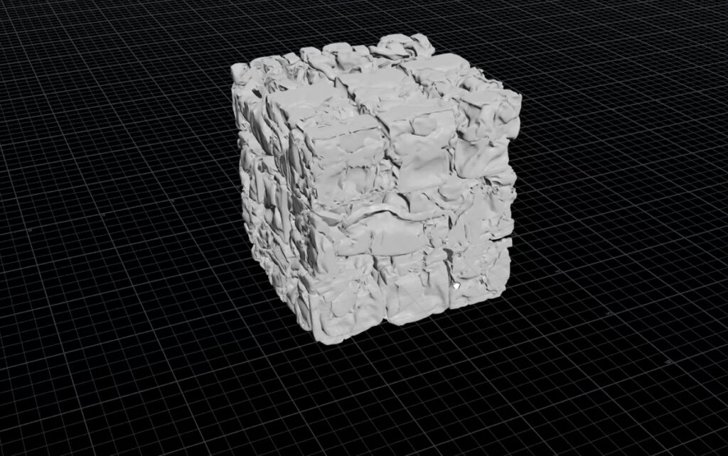 A 3D-rendered cube with a rough, uneven surface resembling crumpled fabric. The cube is set on a black, grid-patterned background.